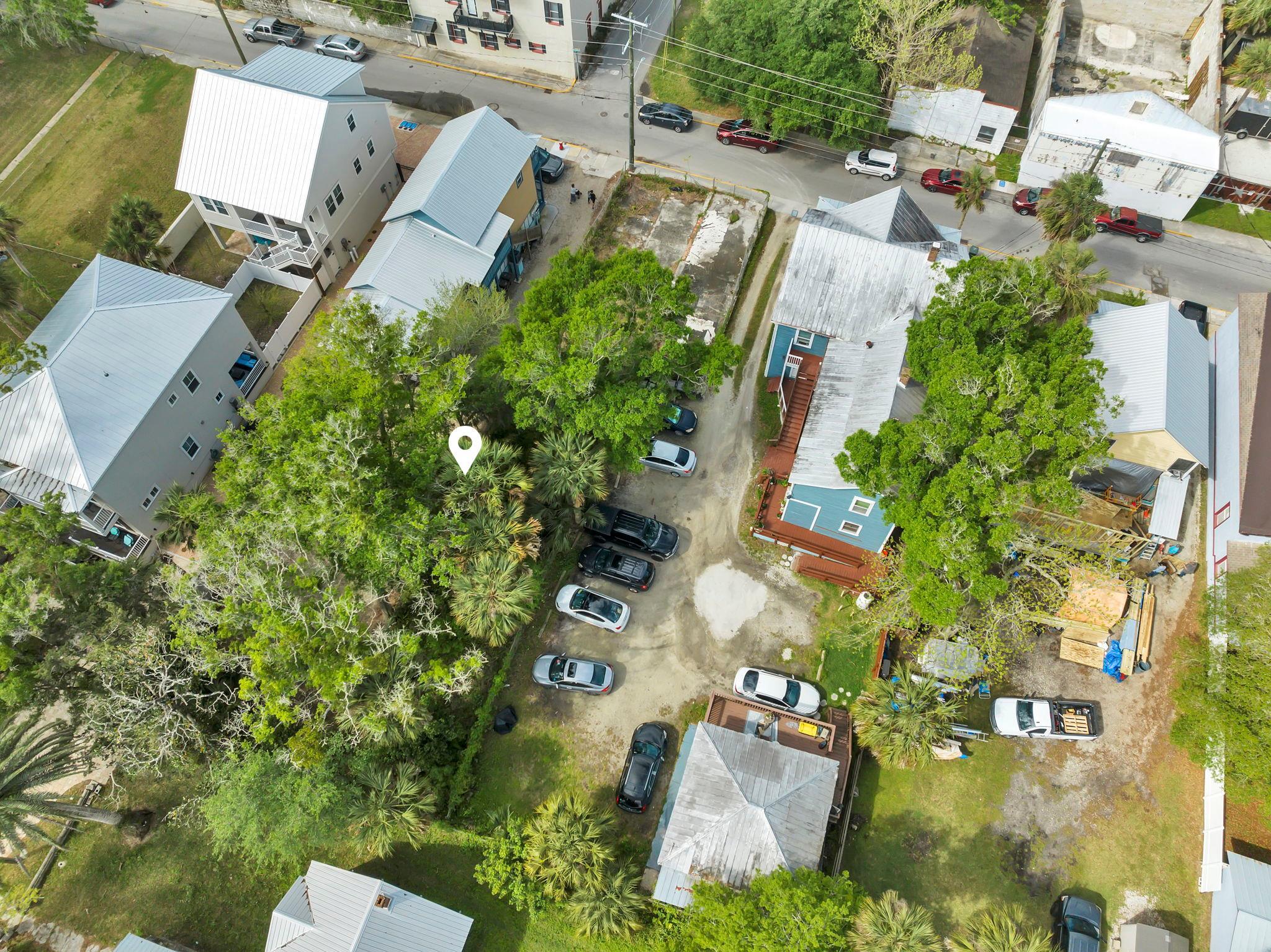 89 Washington Street St. Augustine, FL 32084 - Photo 19 of 42 an aerial view of residential house with outdoor space and trees all around