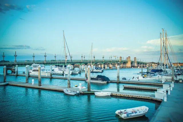 a view of a lake with boats next to building
