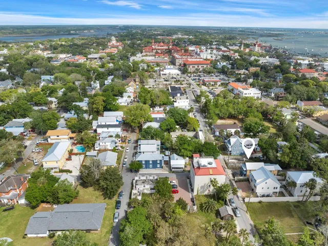 an aerial view of residential houses with outdoor space