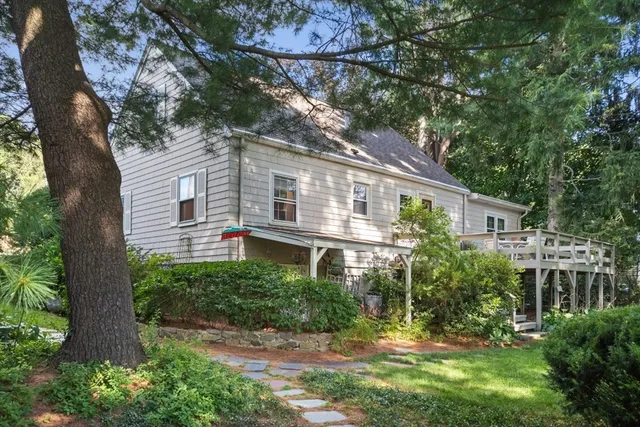 a view of house with a yard