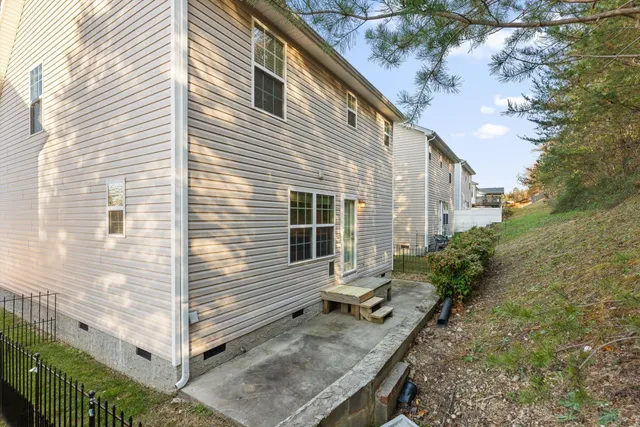 a view of house with backyard