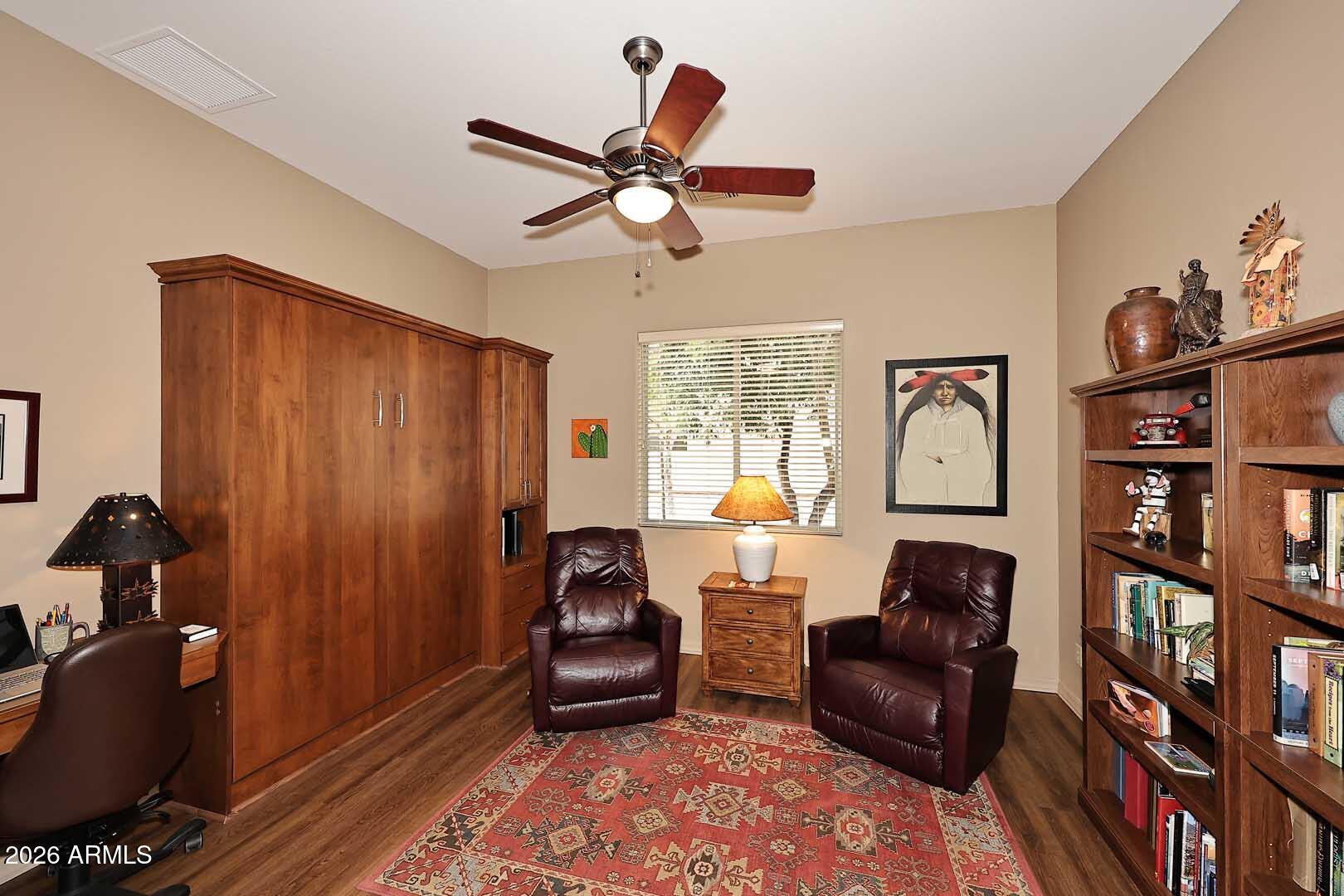 27921 North Quail Spring Road Rio Verde, AZ 85263 - Photo 17 of 49 a living room with furniture a rug and a window