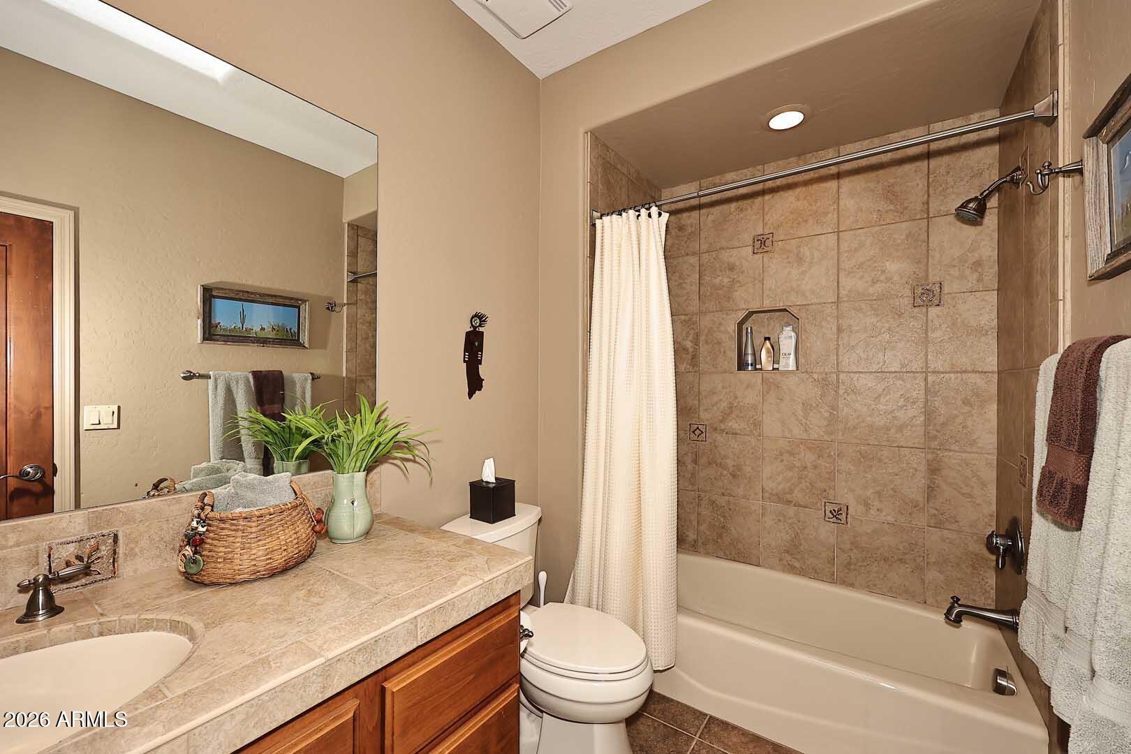 27921 North Quail Spring Road Rio Verde, AZ 85263 - Photo 19 of 49 a bathroom with a granite countertop sink toilet and shower