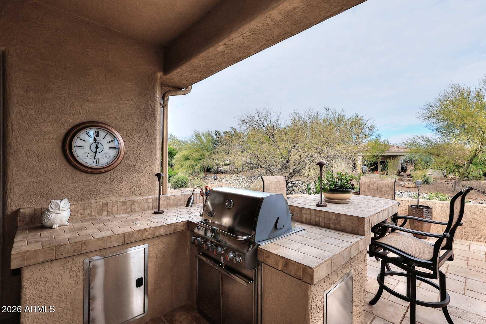 27921 North Quail Spring Road Rio Verde, AZ 85263 - Photo 30 of 49 a outdoor space with a sink and a stove