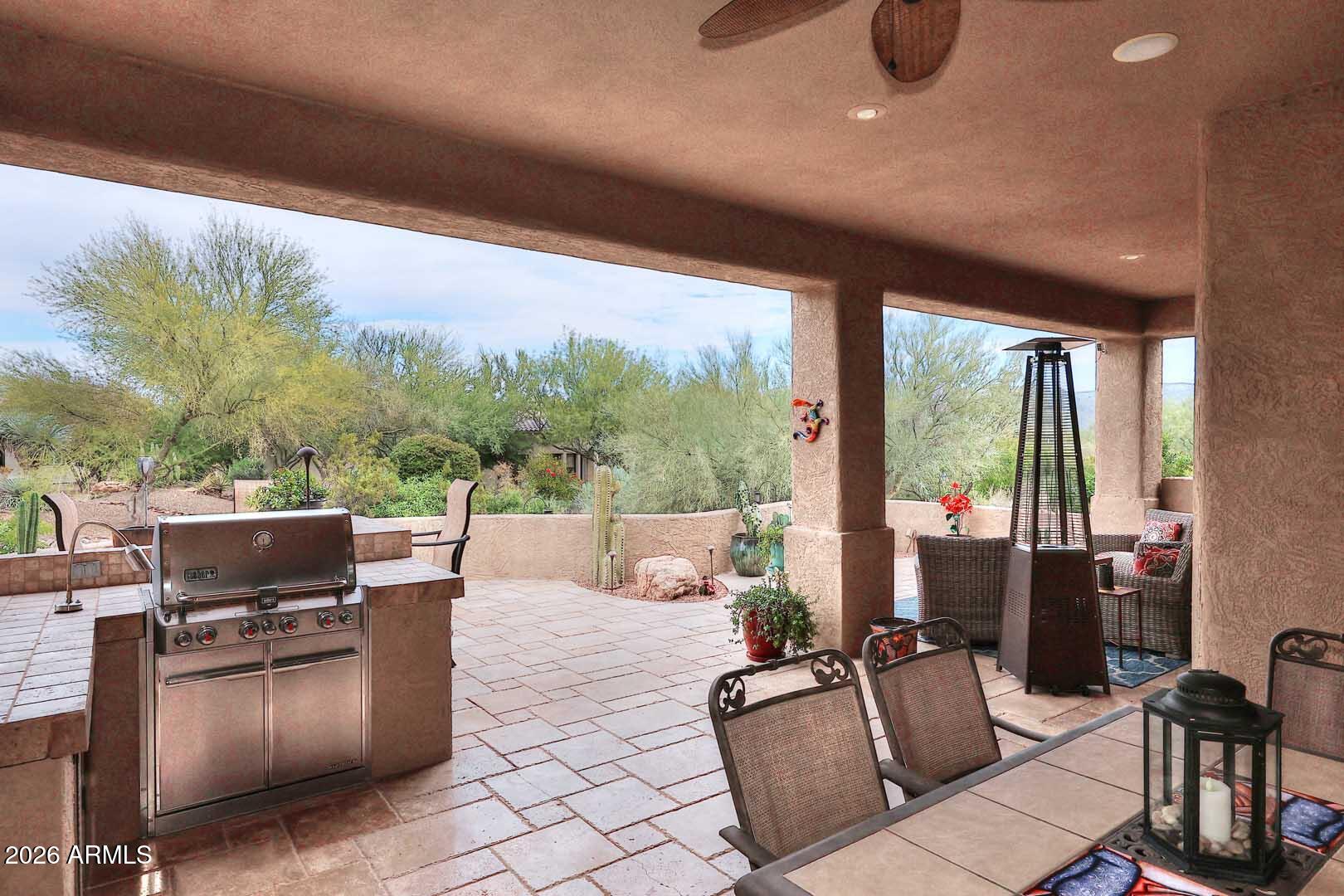 27921 North Quail Spring Road Rio Verde, AZ 85263 - Photo 34 of 49 a living room with patio furniture and a floor to ceiling window