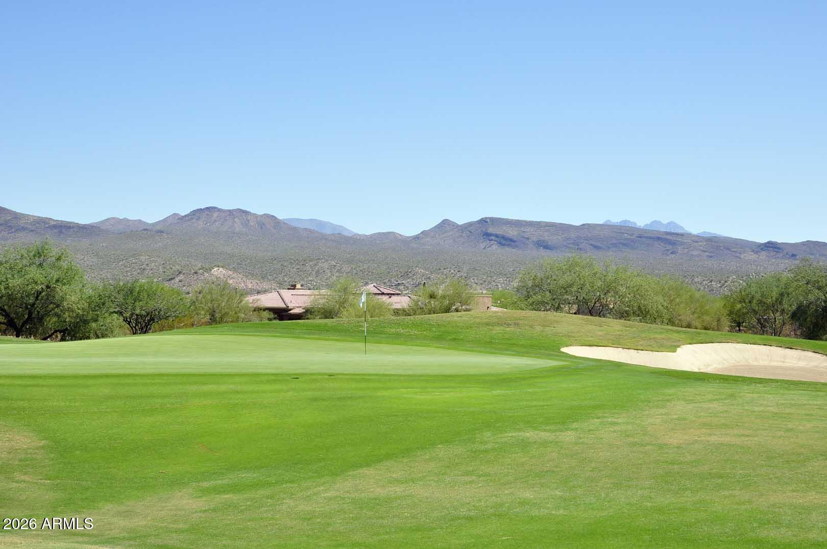 27921 North Quail Spring Road Rio Verde, AZ 85263 - Photo 40 of 49 a view of grassy field with mountains in the background