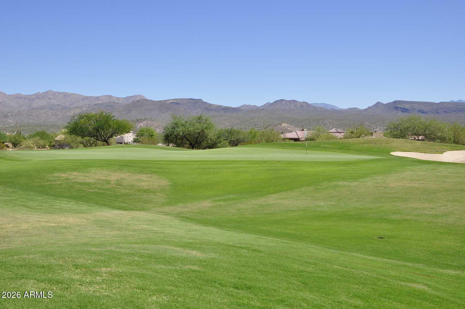 27921 North Quail Spring Road Rio Verde, AZ 85263 - Photo 41 of 49 a view of a lush green hillside and a houses