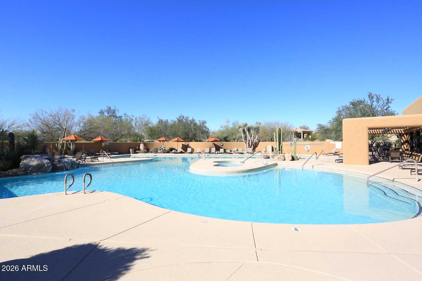 27921 North Quail Spring Road Rio Verde, AZ 85263 - Photo 43 of 49 a view of a swimming pool and an outdoor seating