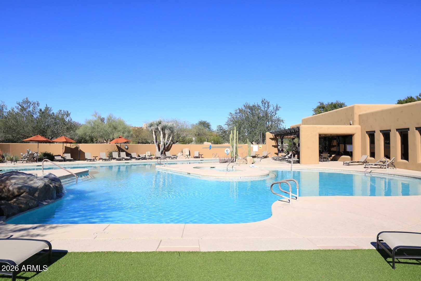 27921 North Quail Spring Road Rio Verde, AZ 85263 - Photo 44 of 49 a view of a backyard with swimming pool
