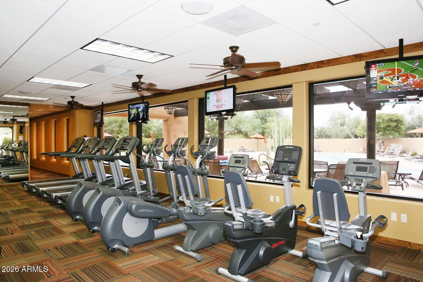 27921 North Quail Spring Road Rio Verde, AZ 85263 - Photo 47 of 49 a view of a livingroom with furniture and floor to ceiling window