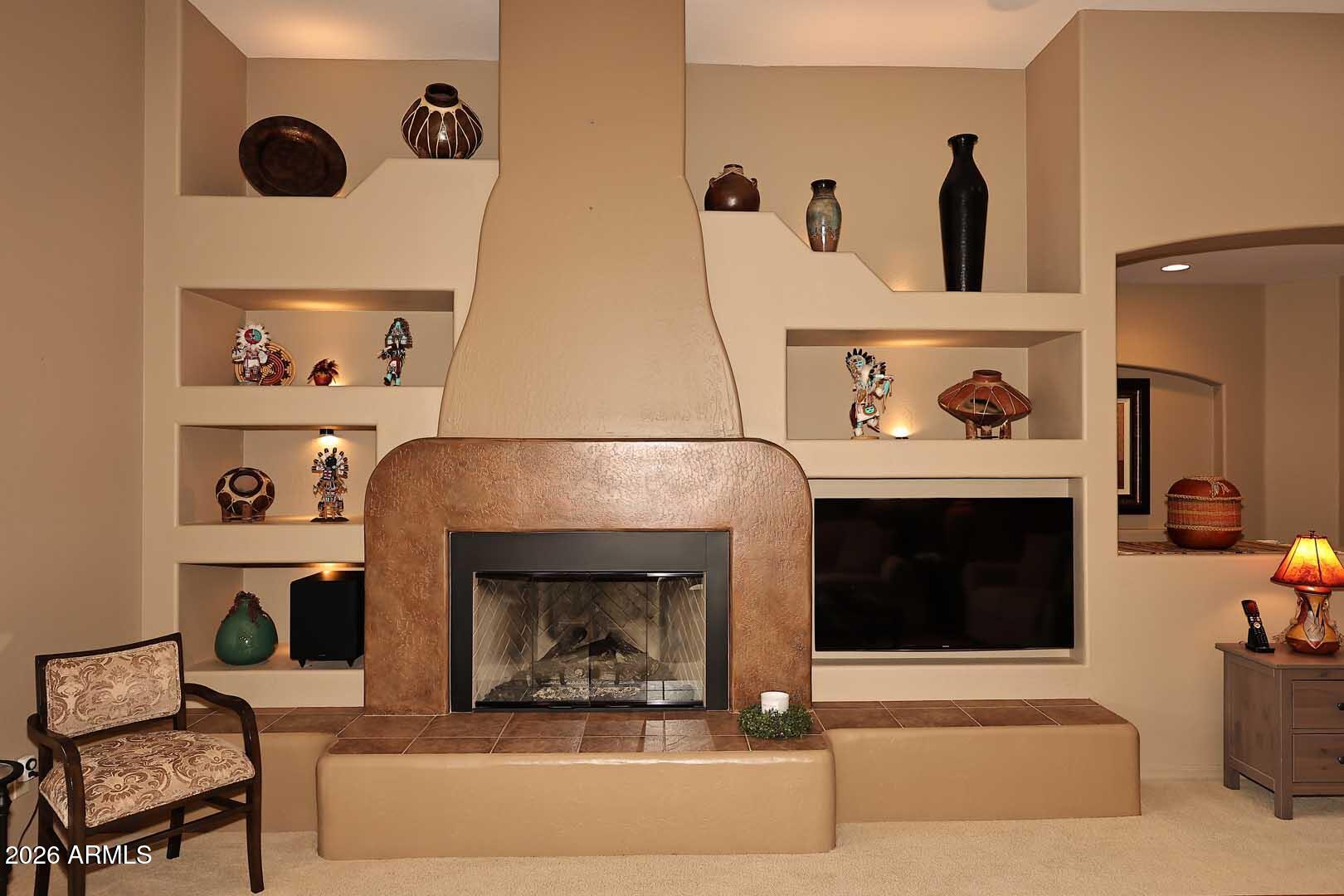 27921 North Quail Spring Road Rio Verde, AZ 85263 - Photo 7 of 49 a living room with furniture and a fireplace