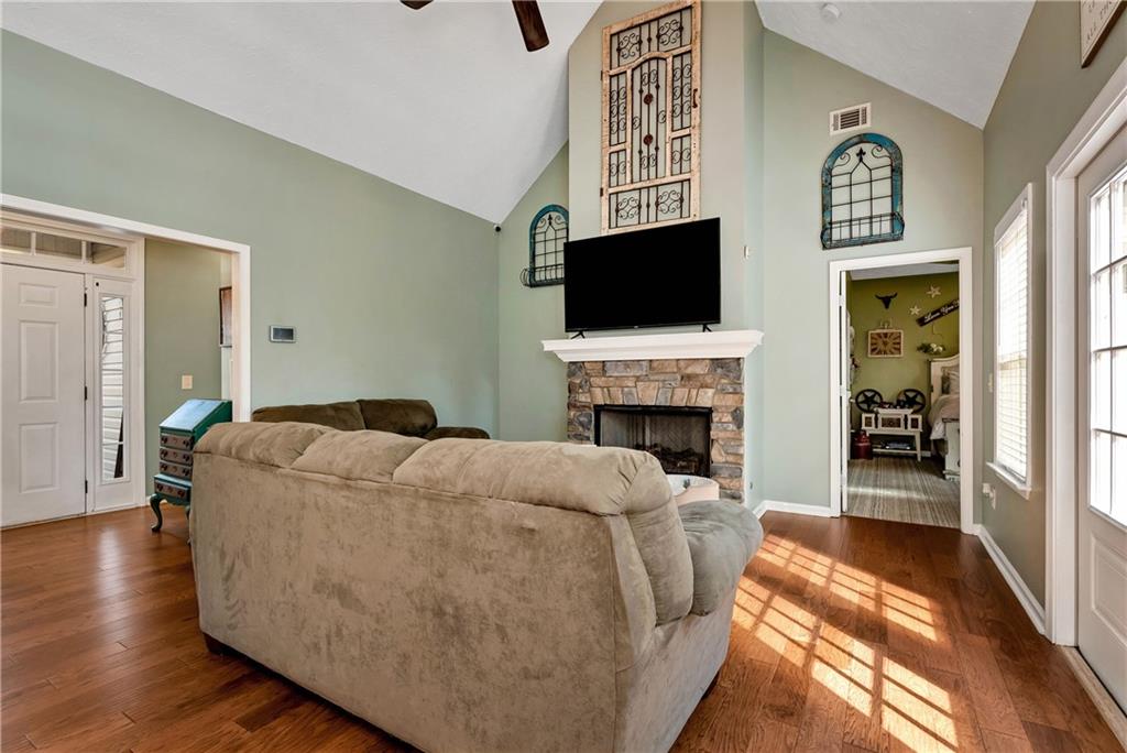 750 Rock Springs Road Lula, GA 30554 - Photo 13 of 72 a living room with furniture fireplace and flat screen tv