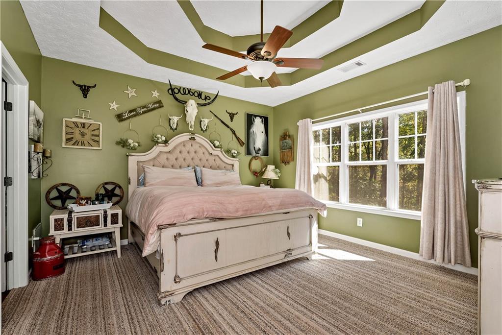 750 Rock Springs Road Lula, GA 30554 - Photo 18 of 72 a bedroom with a bed and a large window with the outer view