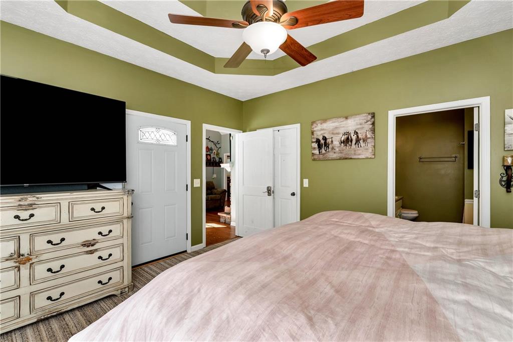 750 Rock Springs Road Lula, GA 30554 - Photo 19 of 72 a bedroom with a bed and a flat screen tv