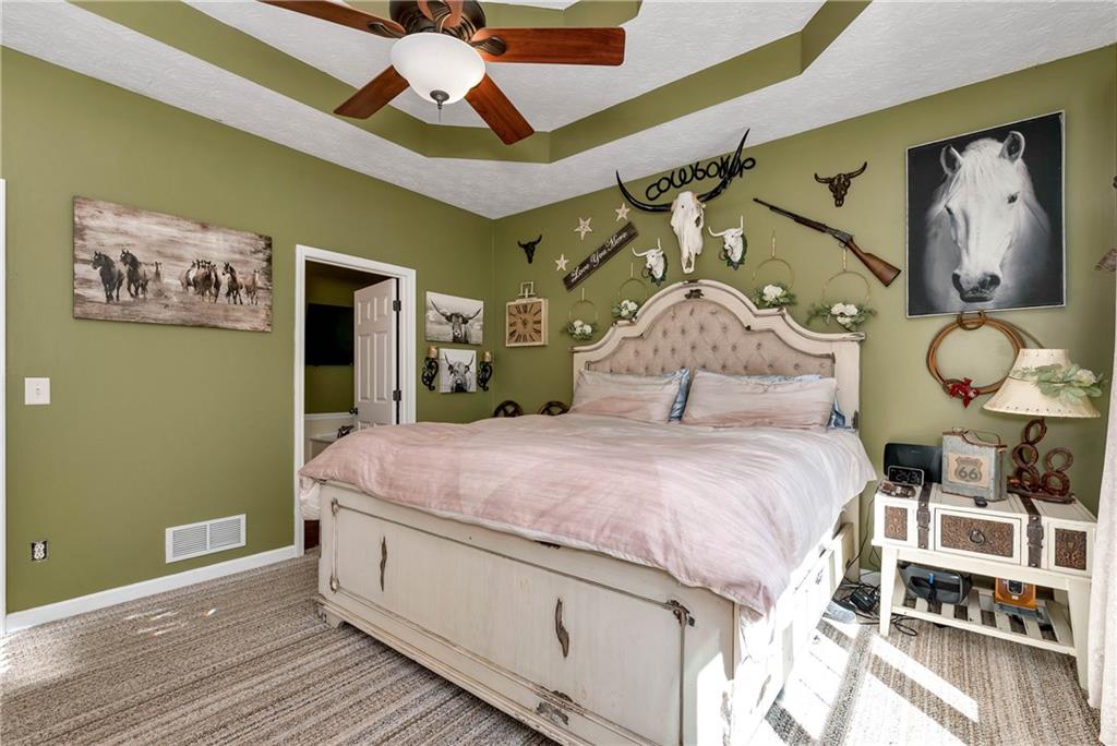 750 Rock Springs Road Lula, GA 30554 - Photo 20 of 72 a bedroom with a bed and a painting on the wall