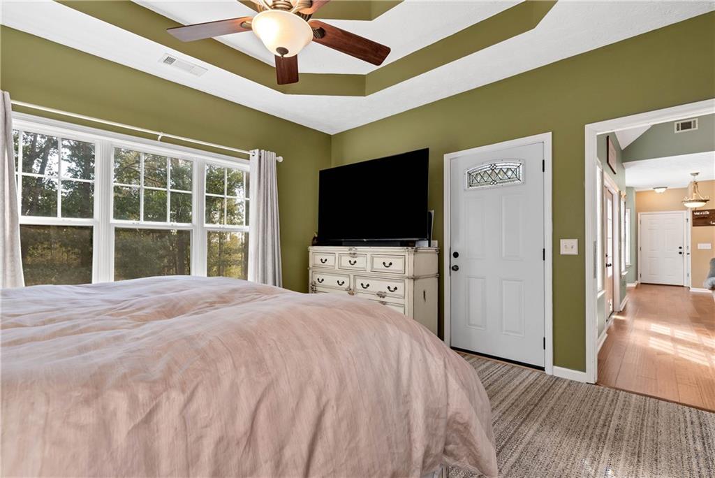 750 Rock Springs Road Lula, GA 30554 - Photo 23 of 72 a bedroom with a bed and a flat screen tv
