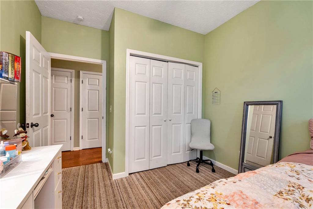 750 Rock Springs Road Lula, GA 30554 - Photo 33 of 72 a bedroom with a bed and a dresser