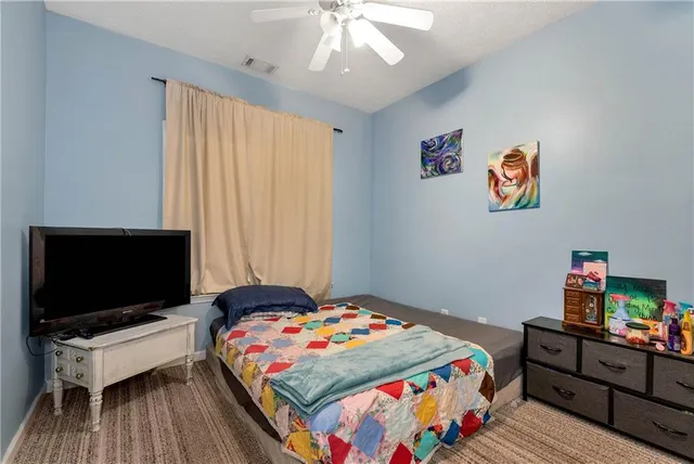a living room with furniture floor to ceiling window and wooden floor
