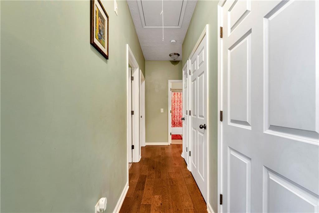 750 Rock Springs Road Lula, GA 30554 - Photo 38 of 72 a view of a hallway with wooden floor and staircase