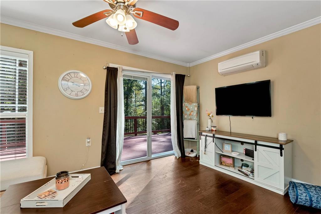 750 Rock Springs Road Lula, GA 30554 - Photo 39 of 72 a living room with furniture and a flat screen tv