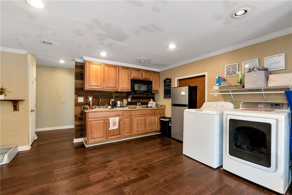 750 Rock Springs Road Lula, GA 30554 - Photo 41 of 72 a kitchen with sink cabinets and wooden floor