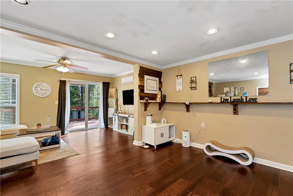750 Rock Springs Road Lula, GA 30554 - Photo 42 of 72 a living room with furniture gym equipment and a large window
