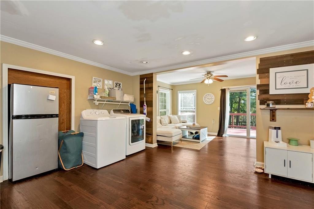 750 Rock Springs Road Lula, GA 30554 - Photo 43 of 72 a living room with furniture floor to ceiling window and wooden floor