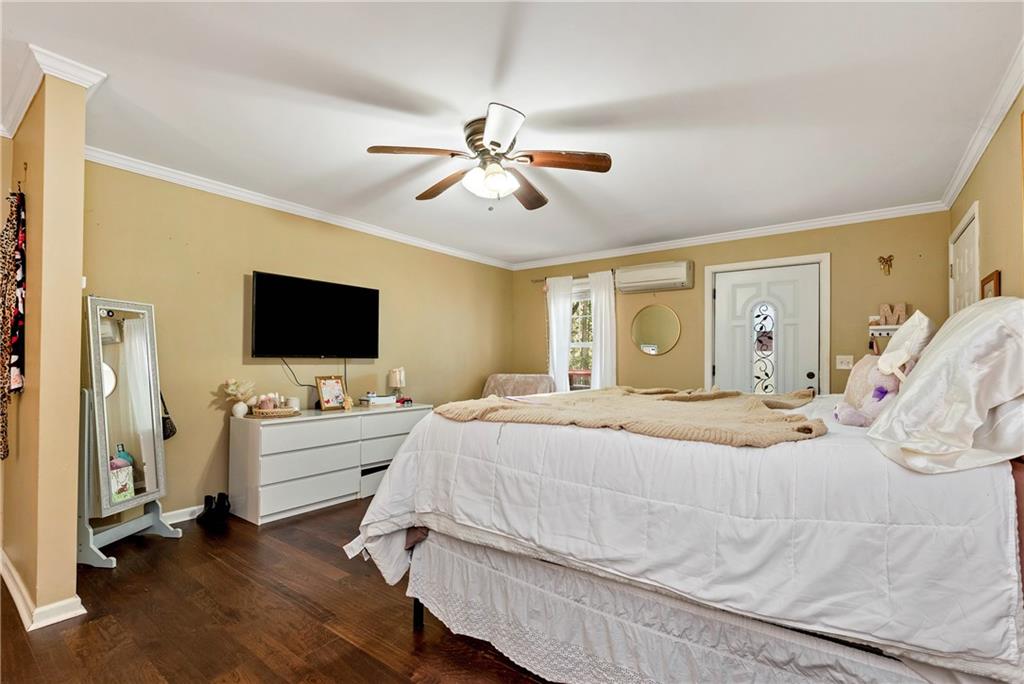 750 Rock Springs Road Lula, GA 30554 - Photo 50 of 72 a bedroom with a bed and a flat screen tv