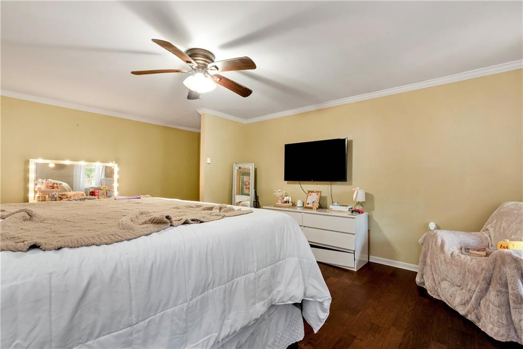 750 Rock Springs Road Lula, GA 30554 - Photo 51 of 72 a bedroom with a bed and a flat screen tv