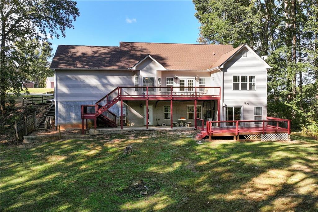 750 Rock Springs Road Lula, GA 30554 - Photo 62 of 72 a view of a house with garden and sitting area