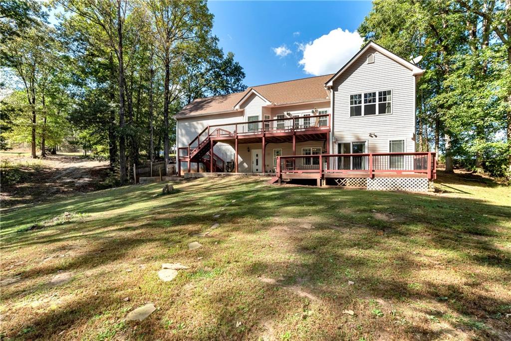 750 Rock Springs Road Lula, GA 30554 - Photo 63 of 72 a view of a house with a yard