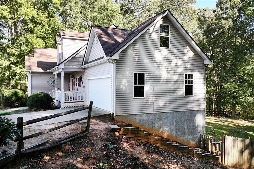 750 Rock Springs Road Lula, GA 30554 - Photo 65 of 72 a view of a house with a yard