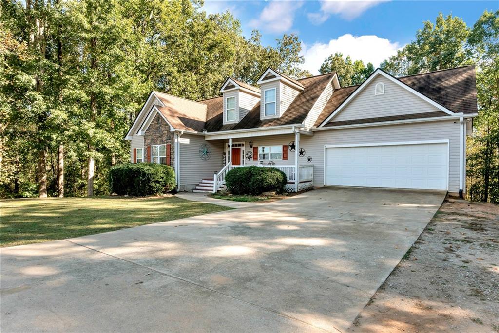 750 Rock Springs Road Lula, GA 30554 - Photo 67 of 72 a front view of a house with a yard and garage
