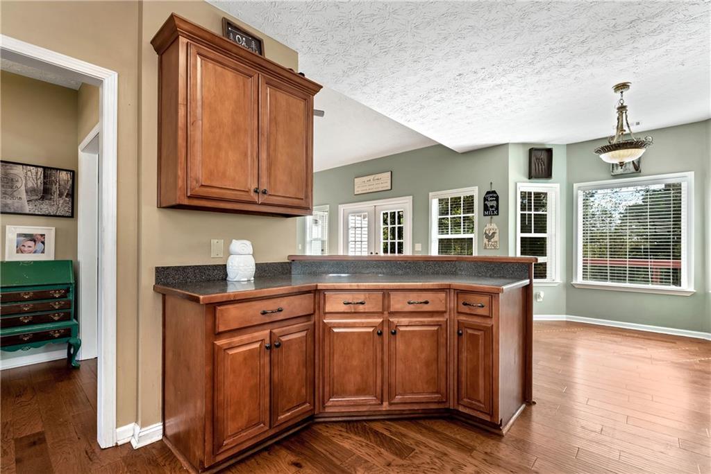 750 Rock Springs Road Lula, GA 30554 - Photo 9 of 72 a kitchen with stainless steel appliances granite countertop a stove and a sink