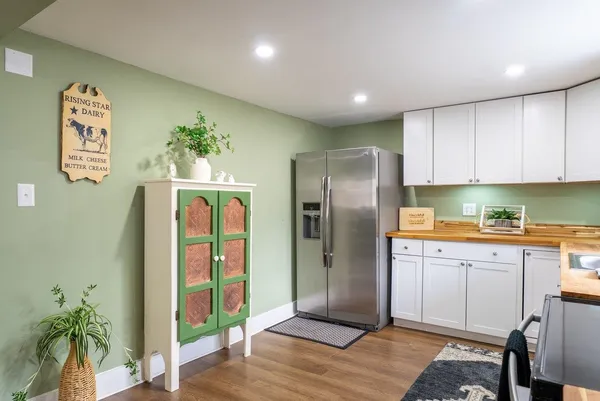 a kitchen with stainless steel appliances granite countertop a stove microwave and cabinets