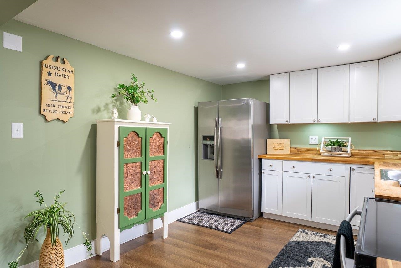 29 Shenandoah Mountain Road Sugar Grove, WV 26815 - Photo 15 of 52 a kitchen with granite countertop a refrigerator and a sink