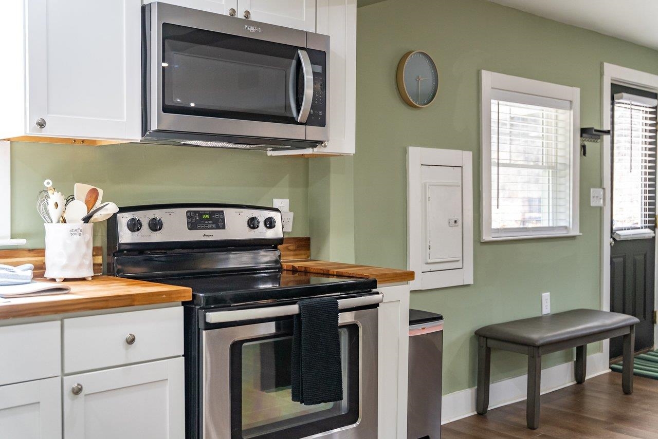 29 Shenandoah Mountain Road Sugar Grove, WV 26815 - Photo 17 of 52 a kitchen with stainless steel appliances granite countertop a stove microwave and cabinets