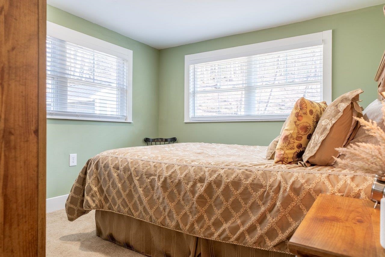 29 Shenandoah Mountain Road Sugar Grove, WV 26815 - Photo 27 of 52 a bed sitting in a bedroom next to a window