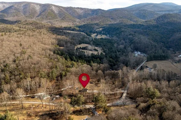 a view of a area with green field and mountains