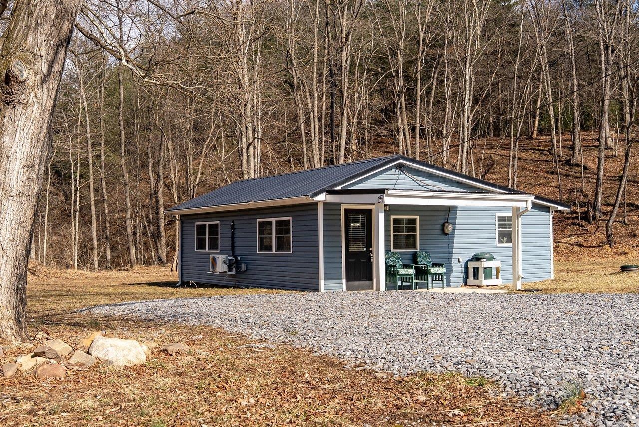 29 Shenandoah Mountain Road Sugar Grove, WV 26815 - Photo 34 of 52 a front view of a house with a yard