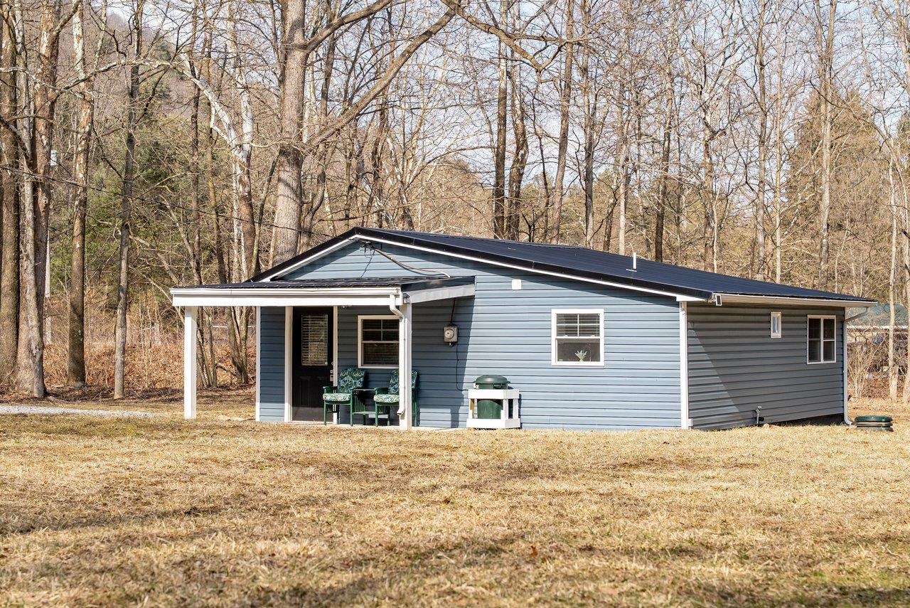 29 Shenandoah Mountain Road Sugar Grove, WV 26815 - Photo 36 of 52 a front view of a house with a yard and garage