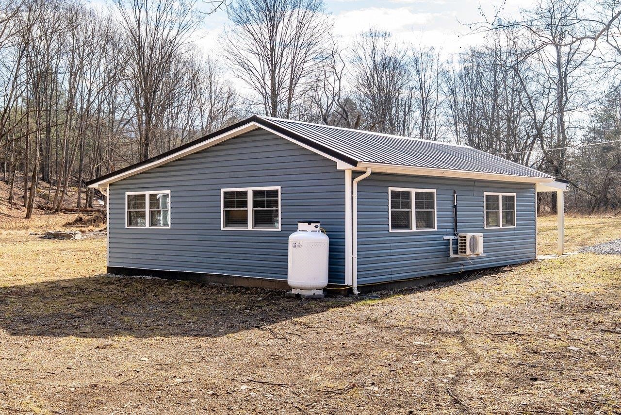 29 Shenandoah Mountain Road Sugar Grove, WV 26815 - Photo 45 of 52 a front view of a house with a yard
