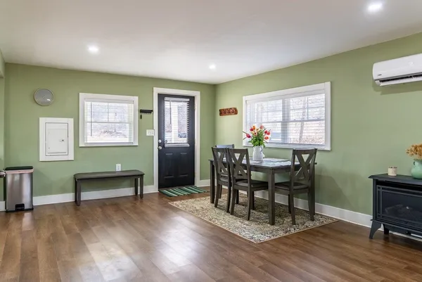 a dining room with furniture and window