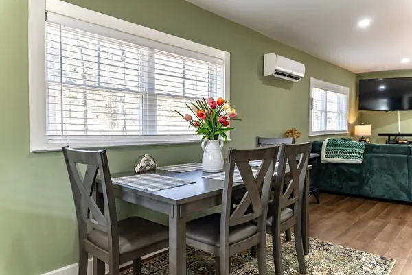 a view of a dining room with furniture and window
