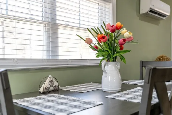 a vase of flowers sitting on a table