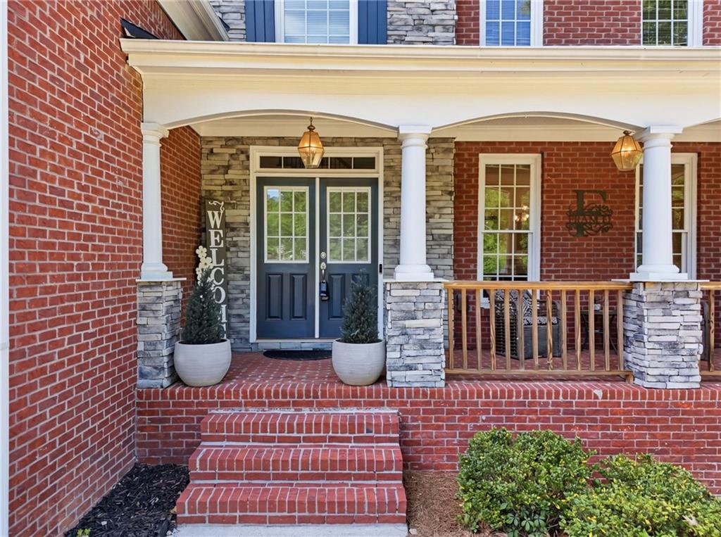 67 Pointer Lane Braselton, GA 30517 - Photo 12 of 74 a view of a house with porch