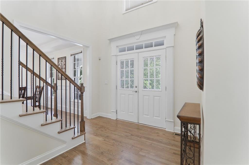 67 Pointer Lane Braselton, GA 30517 - Photo 14 of 74 a view of entryway and hall with wooden floor