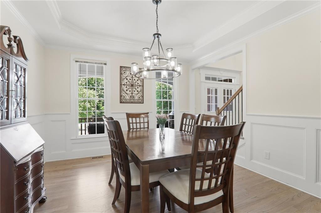 67 Pointer Lane Braselton, GA 30517 - Photo 16 of 74 a view of a dining room with furniture window and wooden floor