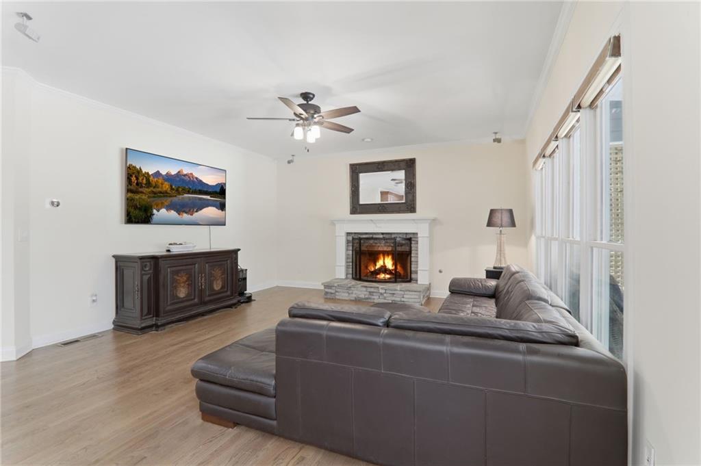 67 Pointer Lane Braselton, GA 30517 - Photo 19 of 74 a living room with furniture a fireplace and a flat screen tv