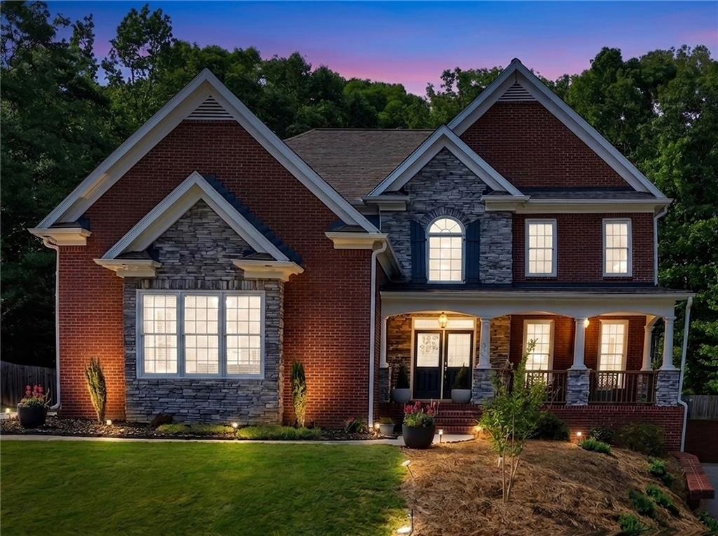 67 Pointer Lane Braselton, GA 30517 - Photo 2 of 74 a front view of a house with a yard